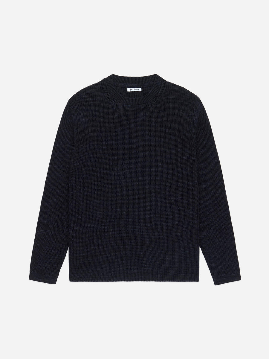 Black sweater on a light gray background